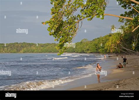 Tourists on main beach next to Cahuita village, Cahuita National Park, Costa Rica Stock Photo ...