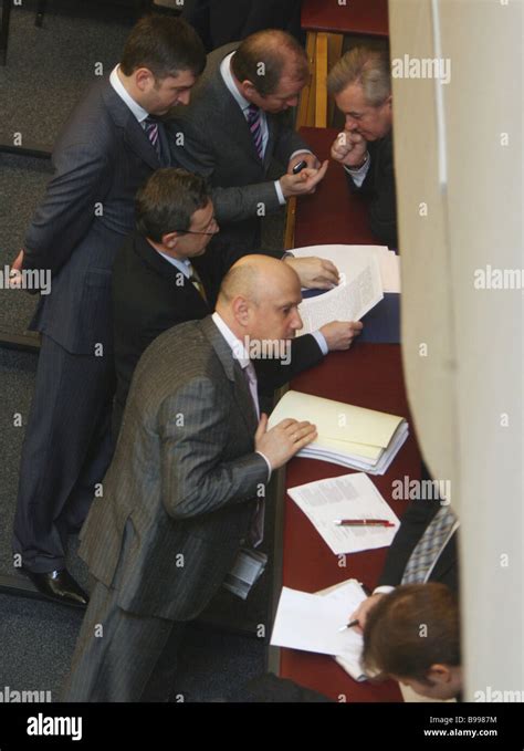 State Duma members gather at the presidential envoy s box during a break between sessions of ...