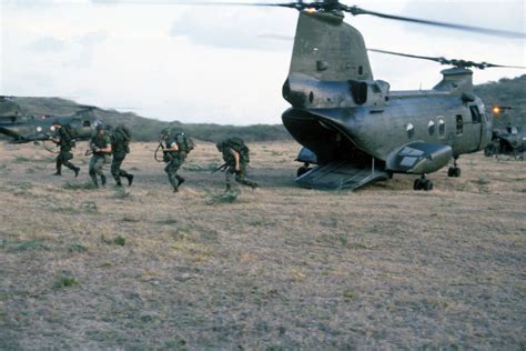 Marines exit a CH-46 Sea Knight helicopter on Vieques Island during ...