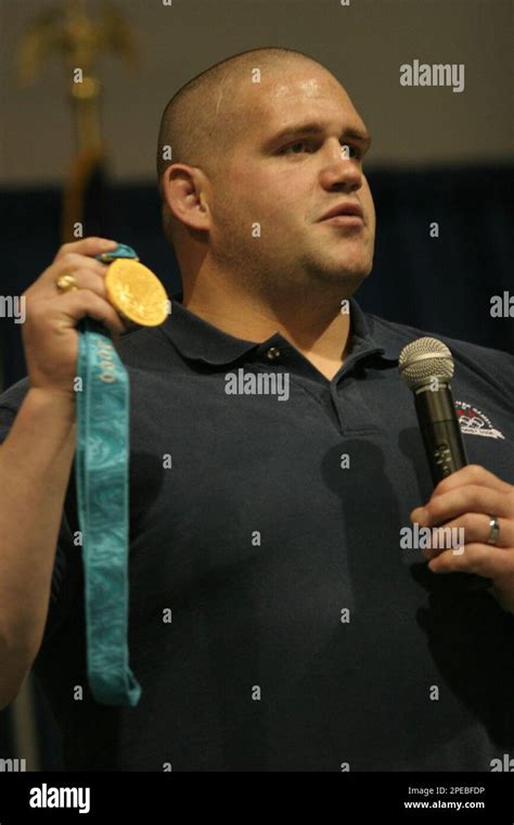 Olympic gold and bronze medalist Rulon Gardner holds the gold medal he earned during the 2000 ...