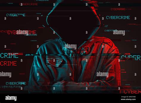 Cybercrime concept with faceless hooded male person, low key red and ...