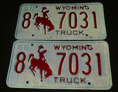 Pair of 1988 Wyoming License Plate Truck Tag 8 7031 Cowboy on Bucking ...