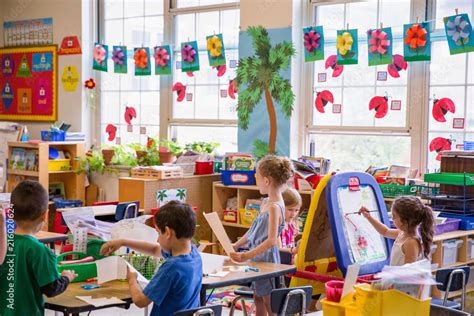 Students working in a kindergarten classroom. Stock Photo | Adobe Stock