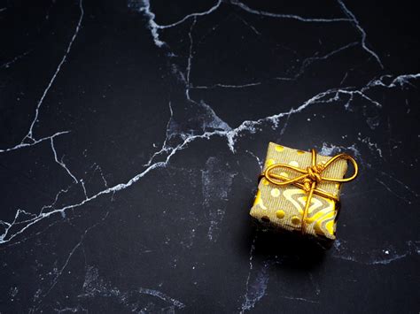 Close up gift box on black marble top view copy space 16688353 Stock Photo at Vecteezy