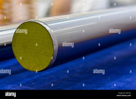 Round stainless steel bar ; grinding process Stock Photo - Alamy