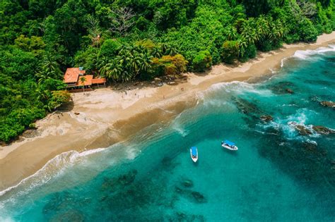 Aerial Drone View of a tropical island with lush jungle in Costa Rica ...