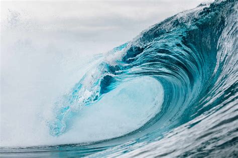 Powerful turquoise breaking ocean waves with white foam stock photo