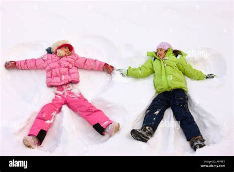 Children making snow angels hi-res stock photography and images - Alamy