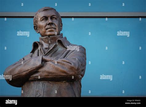 MANCHESTER, UK - MAY 19 2018: Sir Alex Ferguson Bronze statue in front ...