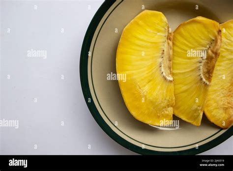 sukun goreng or fried breadfruit served at plate on black background ...