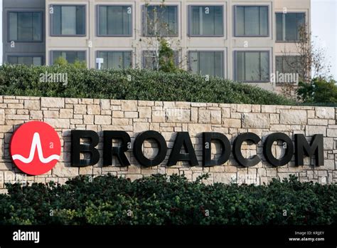 A logo sign outside of the headquarters of the Broadcom Corporation in ...