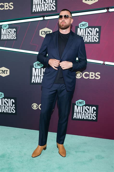 Travis Kelce Soars in Heeled Boots & Navy Suit at CMT Awards 2023 ...