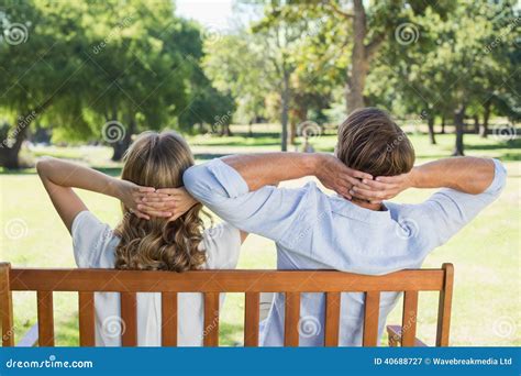 Couple Relaxing on Park Bench Together Stock Image - Image of view, adult: 40688727