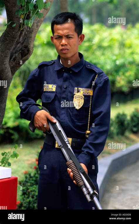 A security guard in the Philippines Stock Photo - Alamy