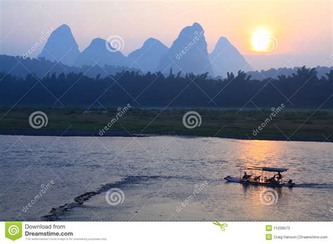 Sunrise on the Li River stock image. Image of pinnacle - 11239573