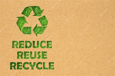 Premium Photo | Kraft paper hole of reuse reduce recycle symbol and text on green grass background