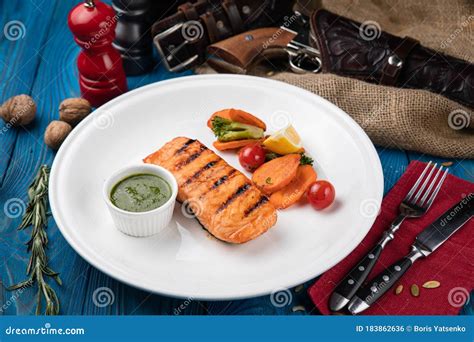 Grilled Salmon With Vegetables On A White Plate Stock Photo - Image of fork, green: 183862636