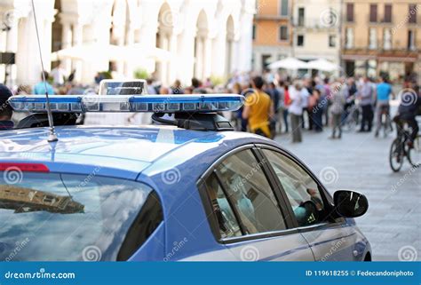 Police Car With Blue Sirens In The Main Square Of The City Stock Image ...