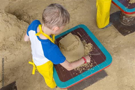 Sand castle made by kids on a craft lesson on beach Stock Photo | Adobe ...