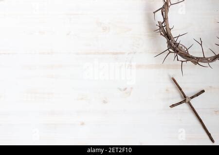 Christian lent border with crown of thorns, simple wood cross and pile ...