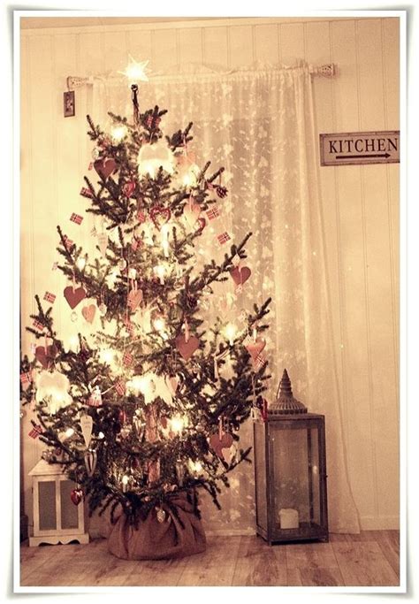 Norwegian christmas tree, I love how rustic and pretty this is! I would ...