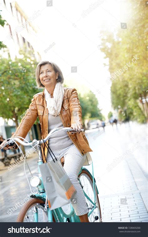 Senior Woman Riding City Bike Town Stock Photo 728069200 | Shutterstock