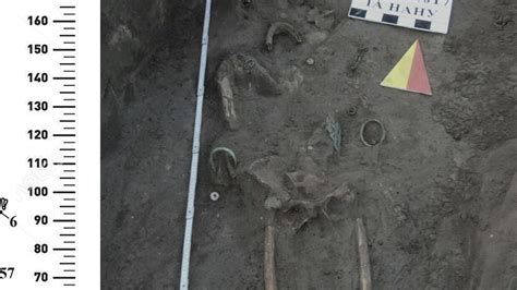 Ancient skeletons with huge necklaces and 'buckets on feet' uncovered ...