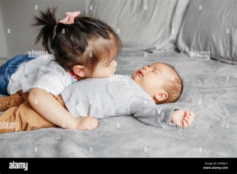 Siblings hug asian hi-res stock photography and images - Alamy