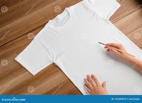 Painting on a White T-shirt Stock Photo - Image of brush, custom: 141664874