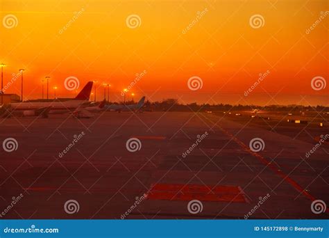 Airport runway at sunset stock photo. Image of fueling - 145172898