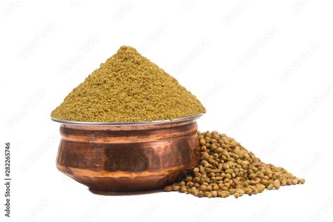 Coriander powder with coriander seeds. Stock Photo | Adobe Stock