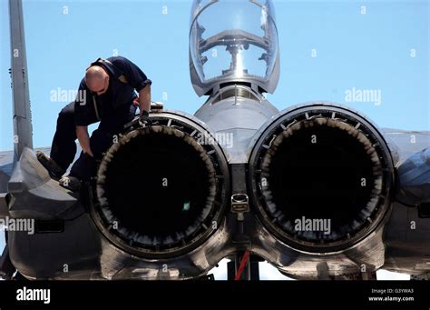 Airman checks an F-15E Strike Eagle for airframe damage Stock Photo - Alamy