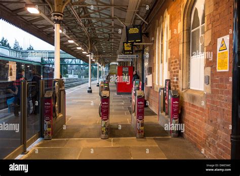 Travelers waiting for a train at Hereford (UK) railway station Stock Photo - Alamy