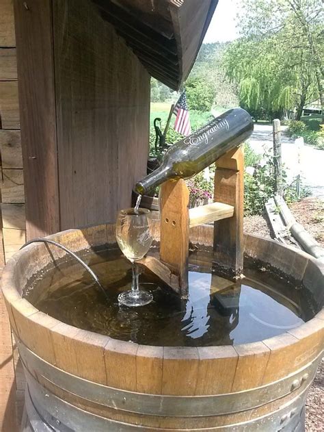 Water Bottle Drinking Fountain 12 | Diy water fountain, Wine barrel garden, Wine bottle fountain