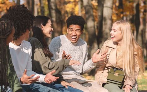 Group of Happy Teenagers Talking and Laughing in Park Stock Photo - Image of happiness ...