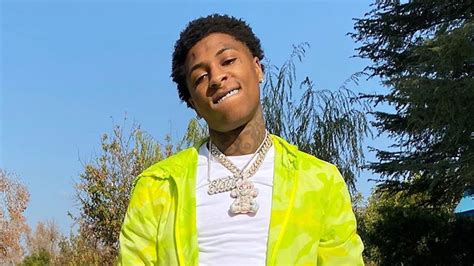 NBA Youngboy Is Wearing White T-Shirt And Green Overcoat Standing In Blue Sky Background HD NBA ...