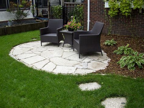 two chairs sitting on top of a stone patio