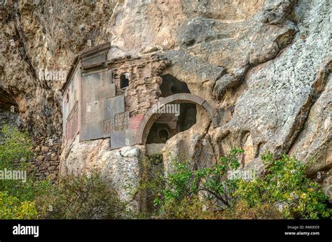 The preserved corner and arched entrance to the cave church in the rock near the territory of ...