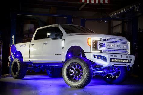 Fabtech Lifted F-250 Platinum on Fuel wheels wrapped with Nittos - Trinity Motorsports