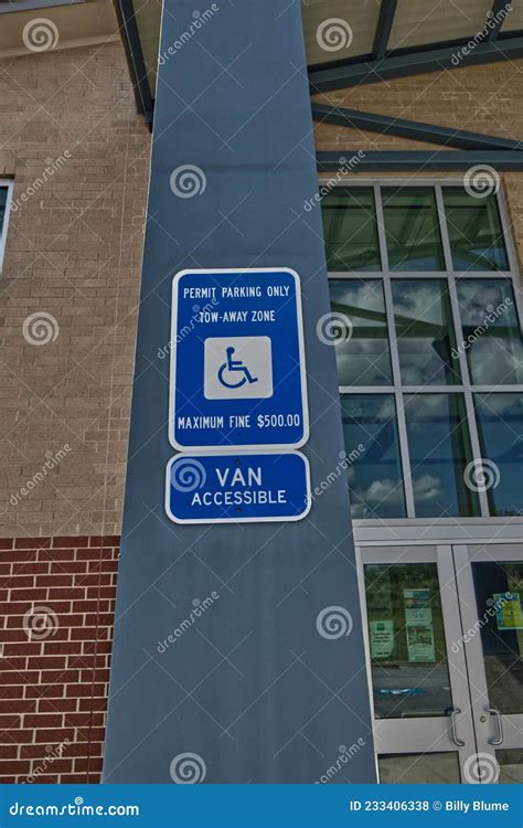 Handicap Sign on a Post and Modern Building Editorial Stock Photo ...