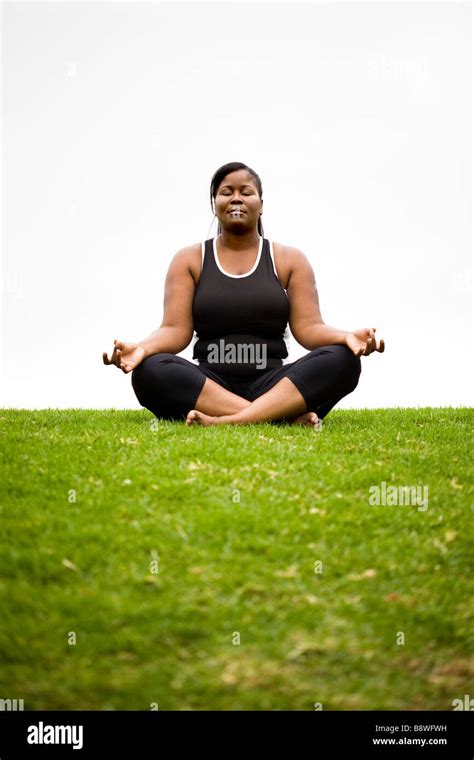 Plus size model in Dhyana yoga pose Stock Photo - Alamy