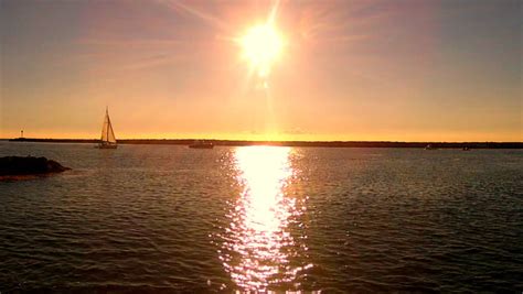 Shot Of The Sun Shining On The Ocean. This Clip Features The Shimmering And Glistening Sun On ...