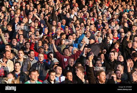 Football fans singing and chanting in the stands Stock Photo - Alamy