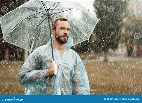 Pensive Man Walking in Rain Stock Photo - Image of reflect, coat: 122515876