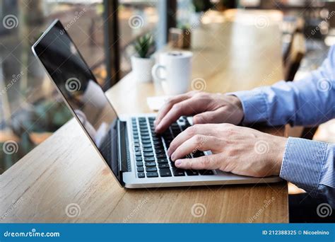 Hands Typing on Laptop Computer Keyboard, Person Writing Email or Report Document in Cafe with ...