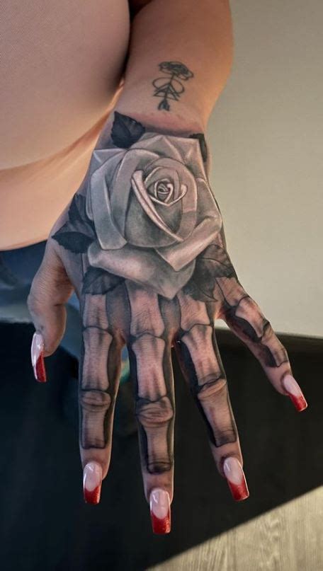 Top more than 75 rose with skeleton hand tattoo latest - in.cdgdbentre