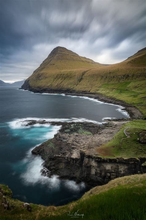 Gjogv, Faroe Islands - Gjogv village on Faroe Islands and its entrance (foreground) to natural ...