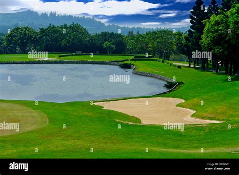 Water hazard in golf course Stock Photo - Alamy