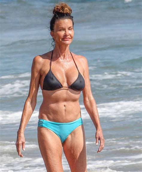 Janice Dickinson, 61, displays enviable abs in tiny bikini following ...