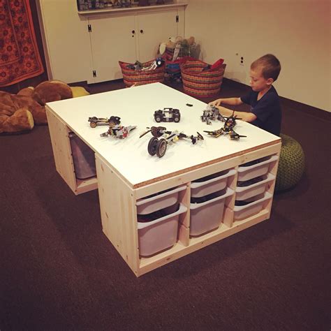 DIY lego table made with 2 IKEA Trofast storage units and a custom cut MDF board. Total cost ...